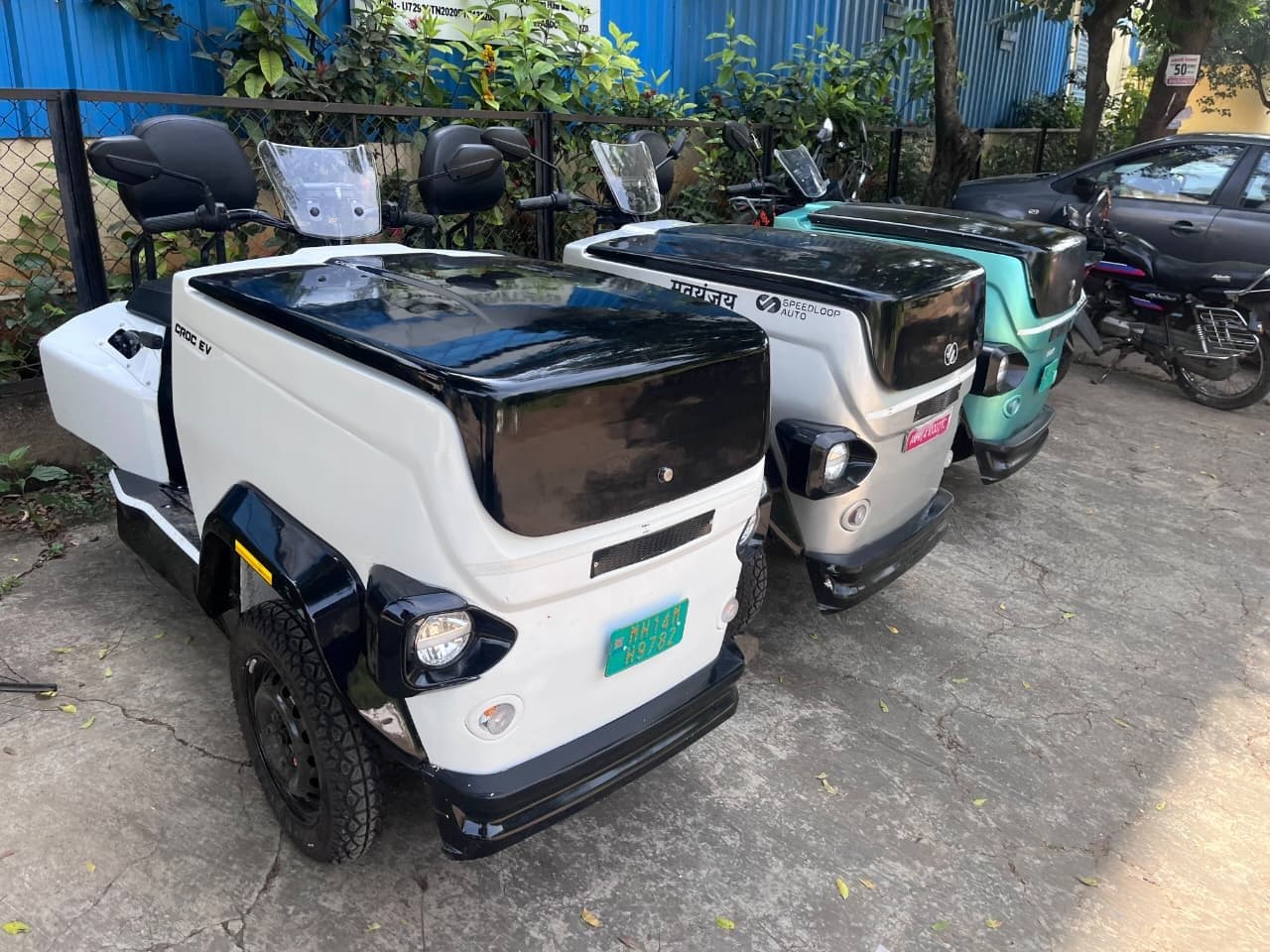 A row of CROC EVs parked in our yard